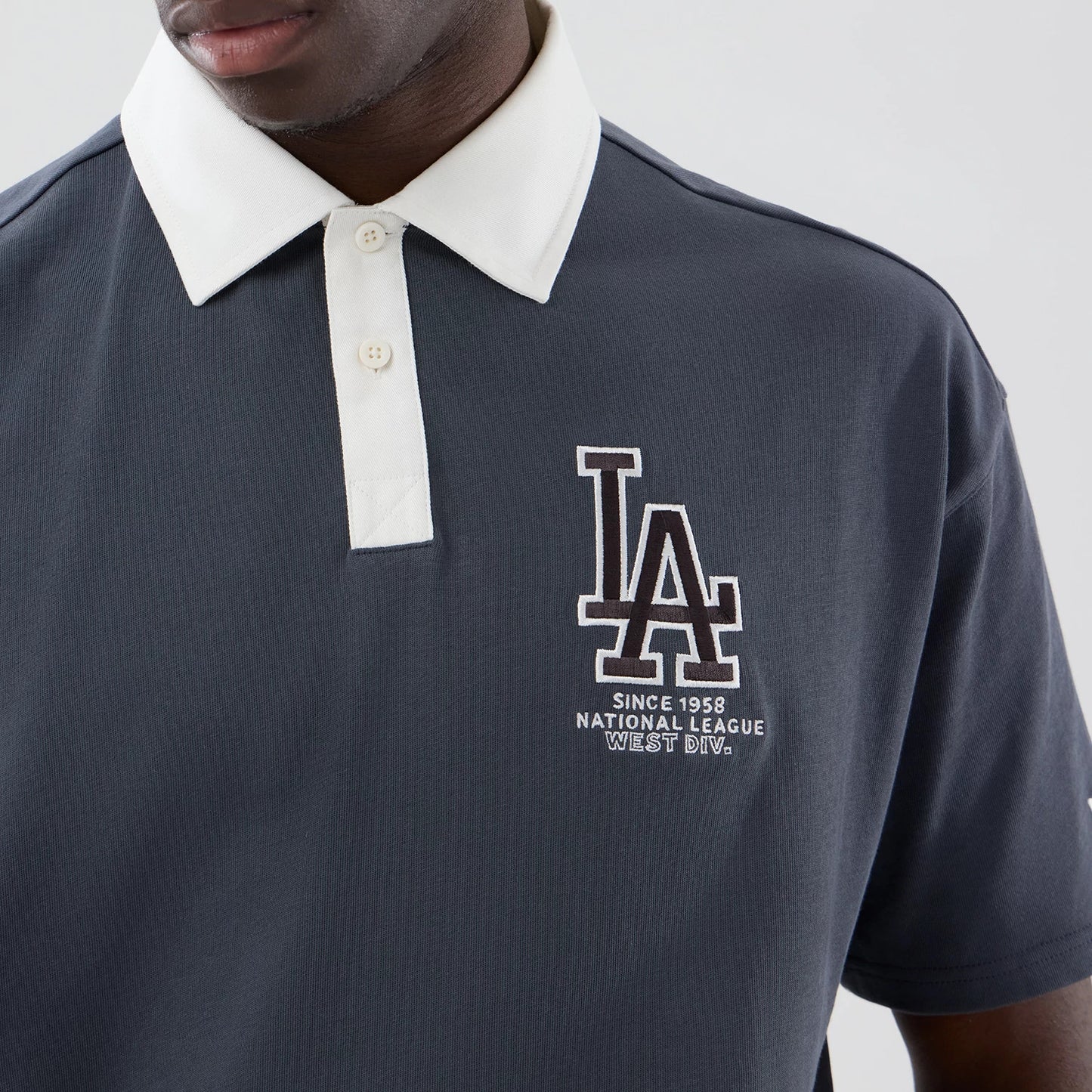The model is wearing this MLB LA Dodgers Polo T-Shirt in grey. 5