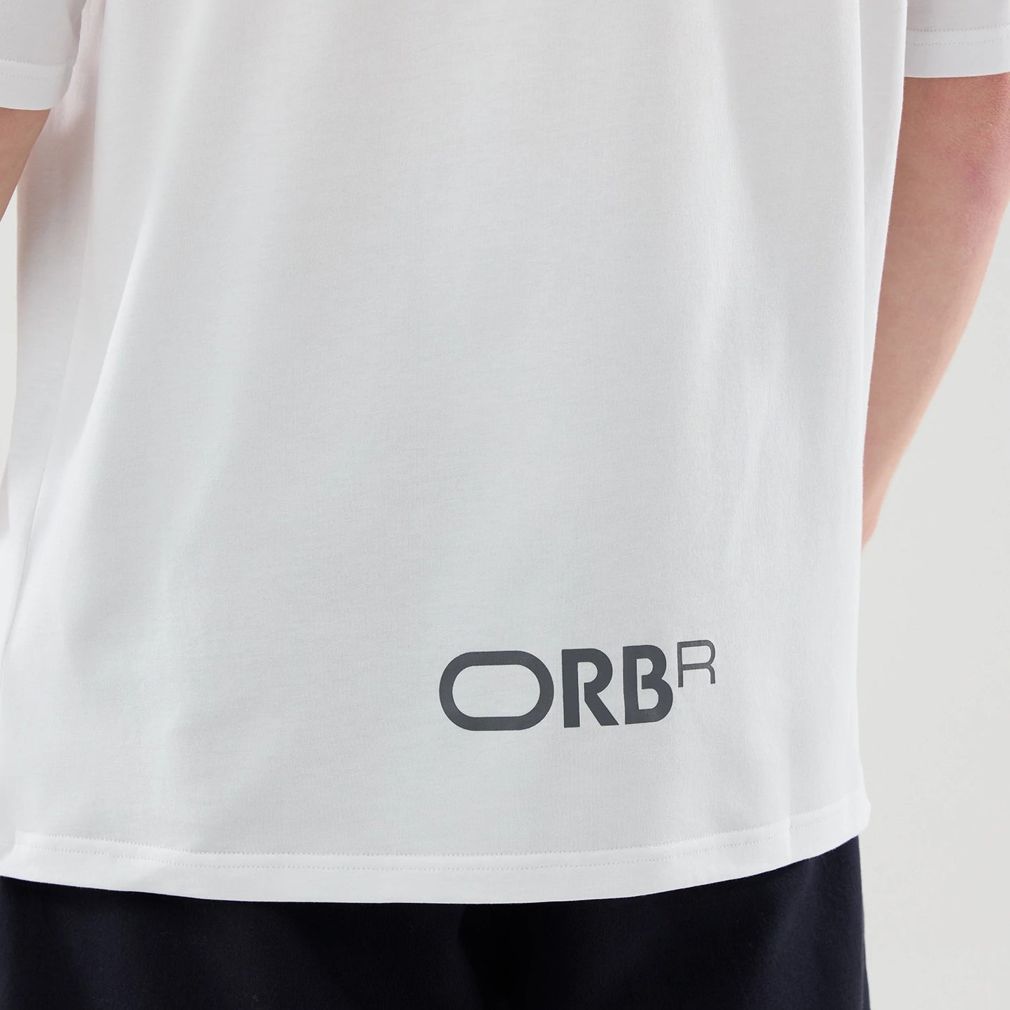 The model is wearing this Red Bull Racing Graphic Oversized T-Shirt in white. 6