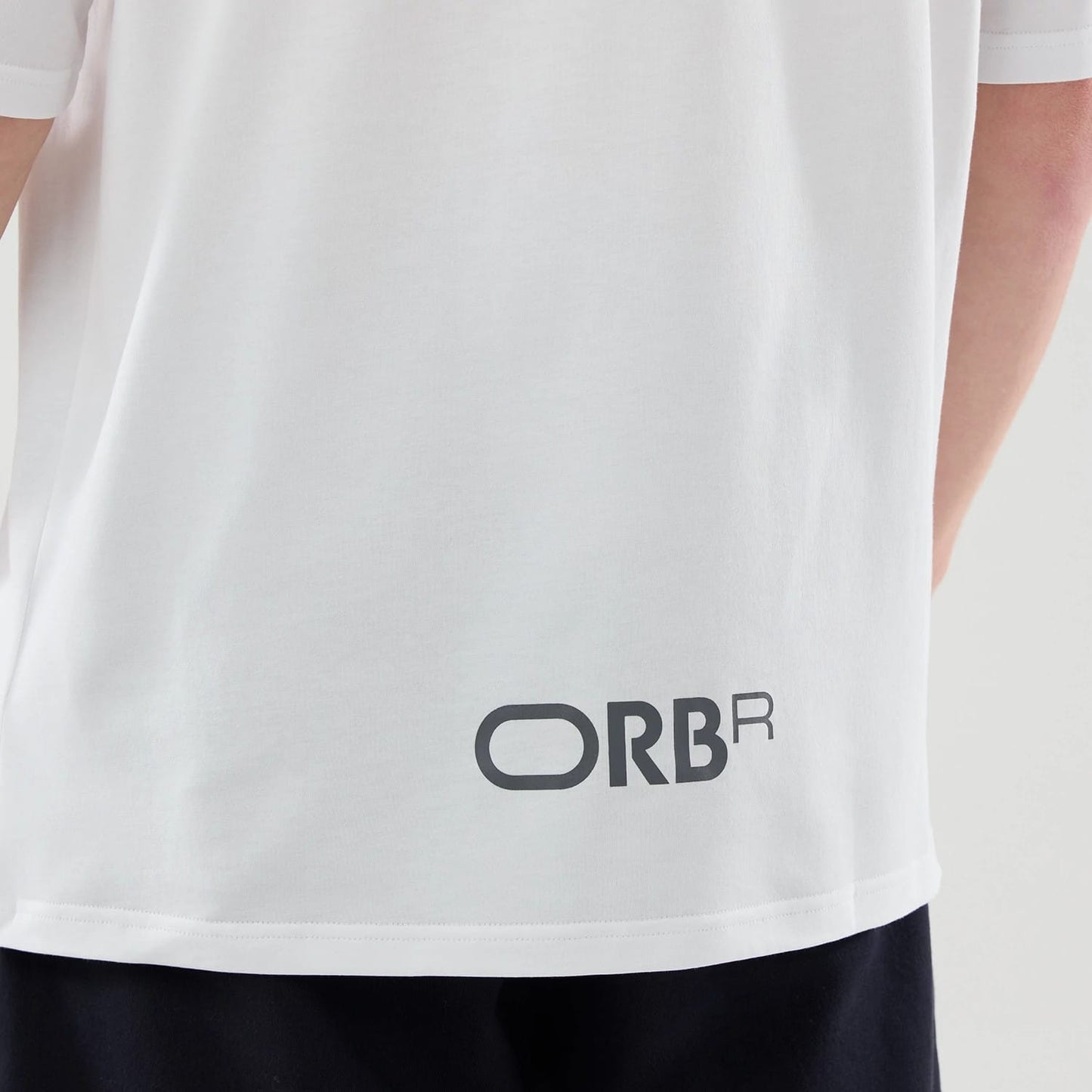 The model is wearing this Red Bull Racing Graphic Oversized T-Shirt in white. 6