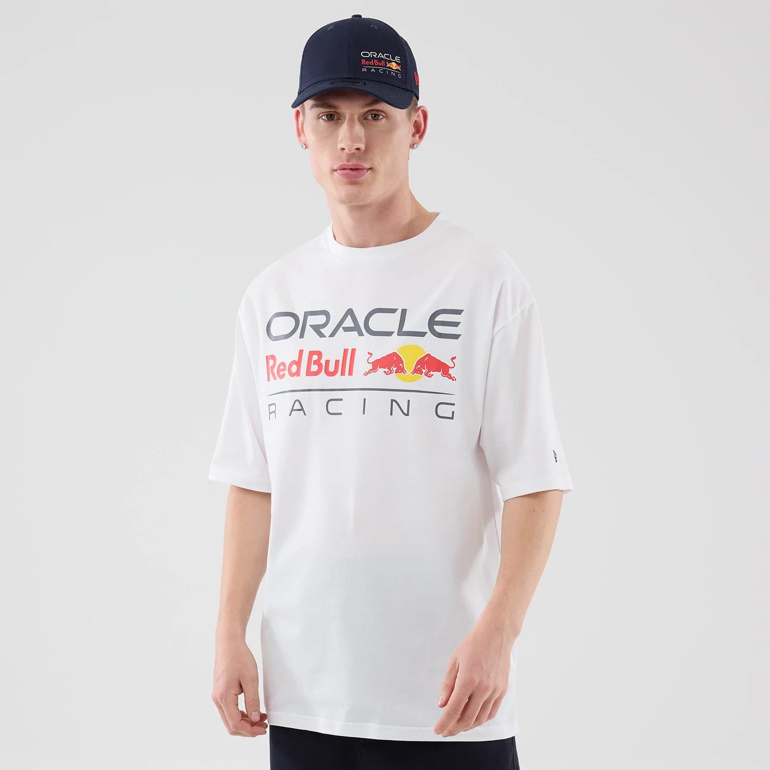 The model is wearing this Red Bull Racing Graphic Oversized T-Shirt in white. 1