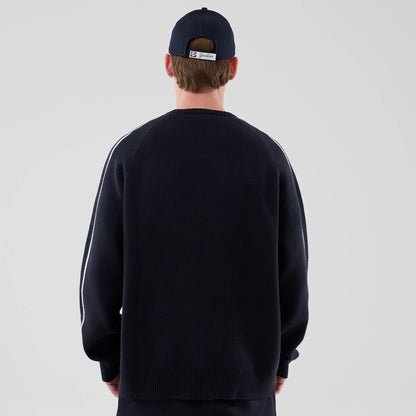 The model is wearing this MLB Knit New York Yankees Knitted Sweater in navy. 2
