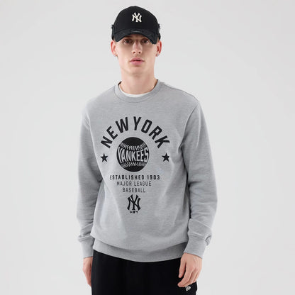 The model is wearing this MLB Graphic New York Yankees Oversized Crew Neck Sweater in grey. 3