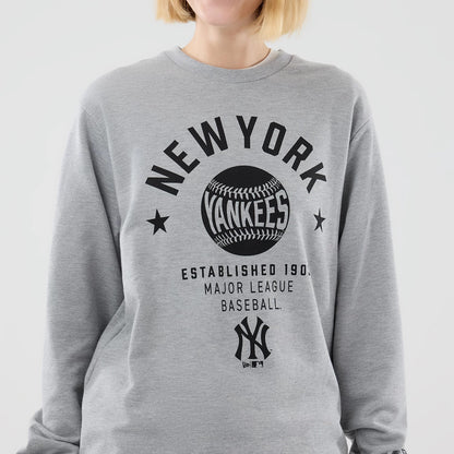 The model is wearing this MLB Graphic New York Yankees Oversized Crew Neck Sweater in grey. 7