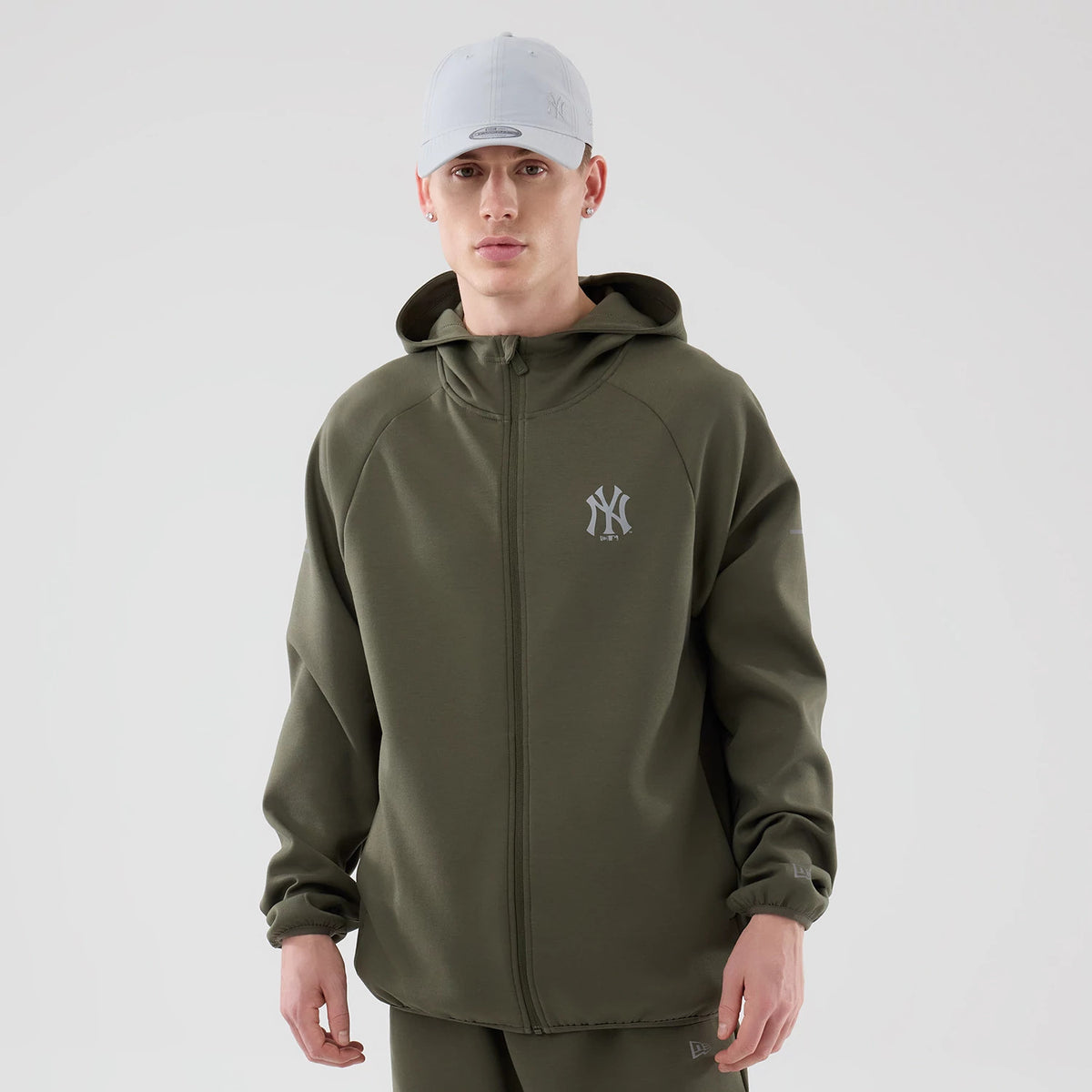 The model is wearing this MLB Core Plus New York Yankees Full Zip Hoodie in green. 1