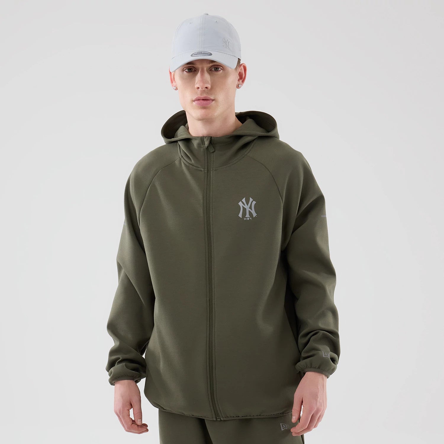 The model is wearing this MLB Core Plus New York Yankees Full Zip Hoodie in green. 1