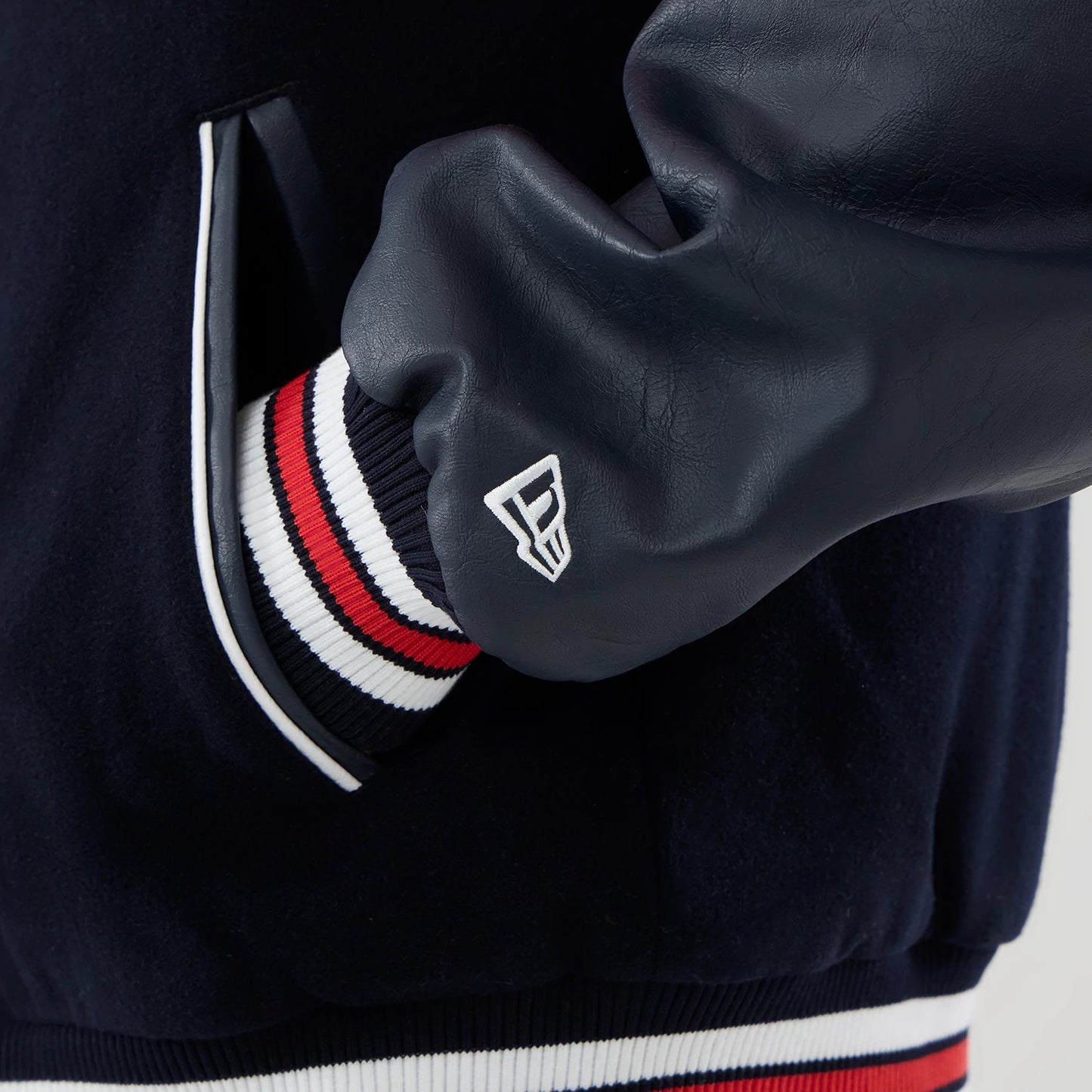 The model is wearing this Red Bull Racing wordmark Varsity Jacket in dark blue. 5