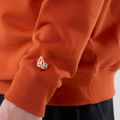 The model is wearing this MLB Arch Graphic New York Yankees Oversized Crew Neck Sweater in Orange. 7