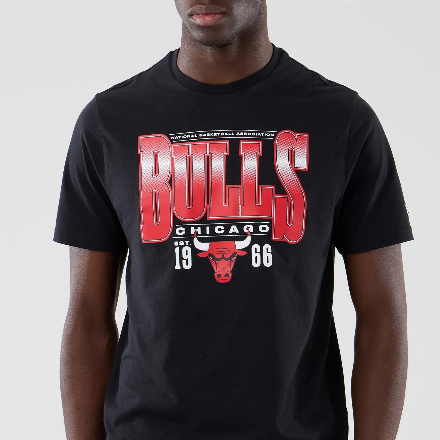 The model is wearing this NBA Arch Graphic Chicago Bulls T-Shirt in black. 3