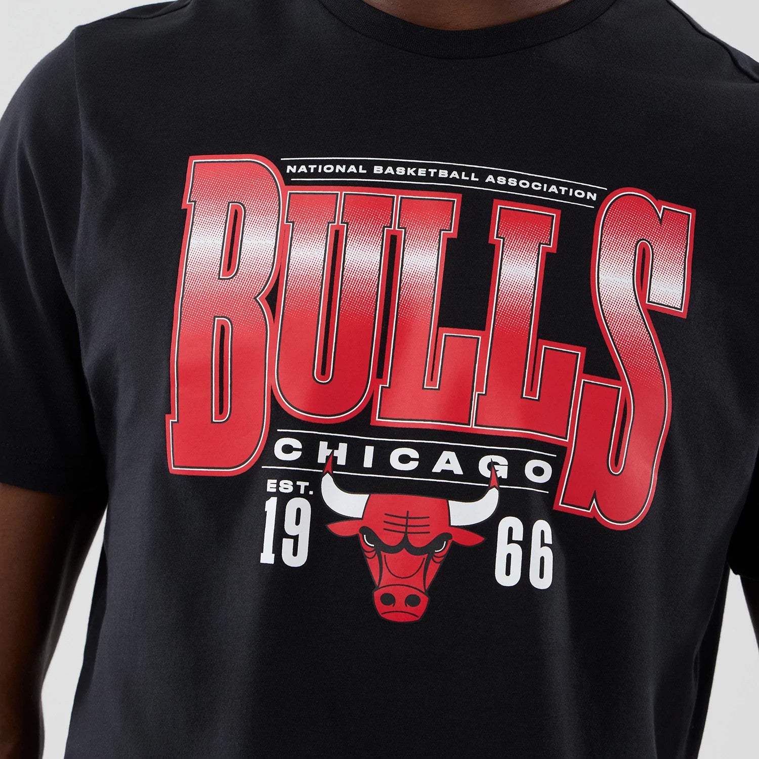 The model is wearing this NBA Arch Graphic Chicago Bulls T-Shirt in black. 4