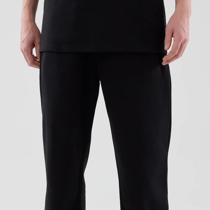 The model is wearing these New Era Tech Reflective Straight Leg Joggers in black. 3