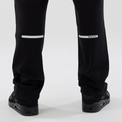 The model is wearing these New Era Tech Straight Leg Joggers in black. 7