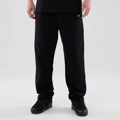 The model is wearing these New Era Tech Straight Leg Joggers in black. 1