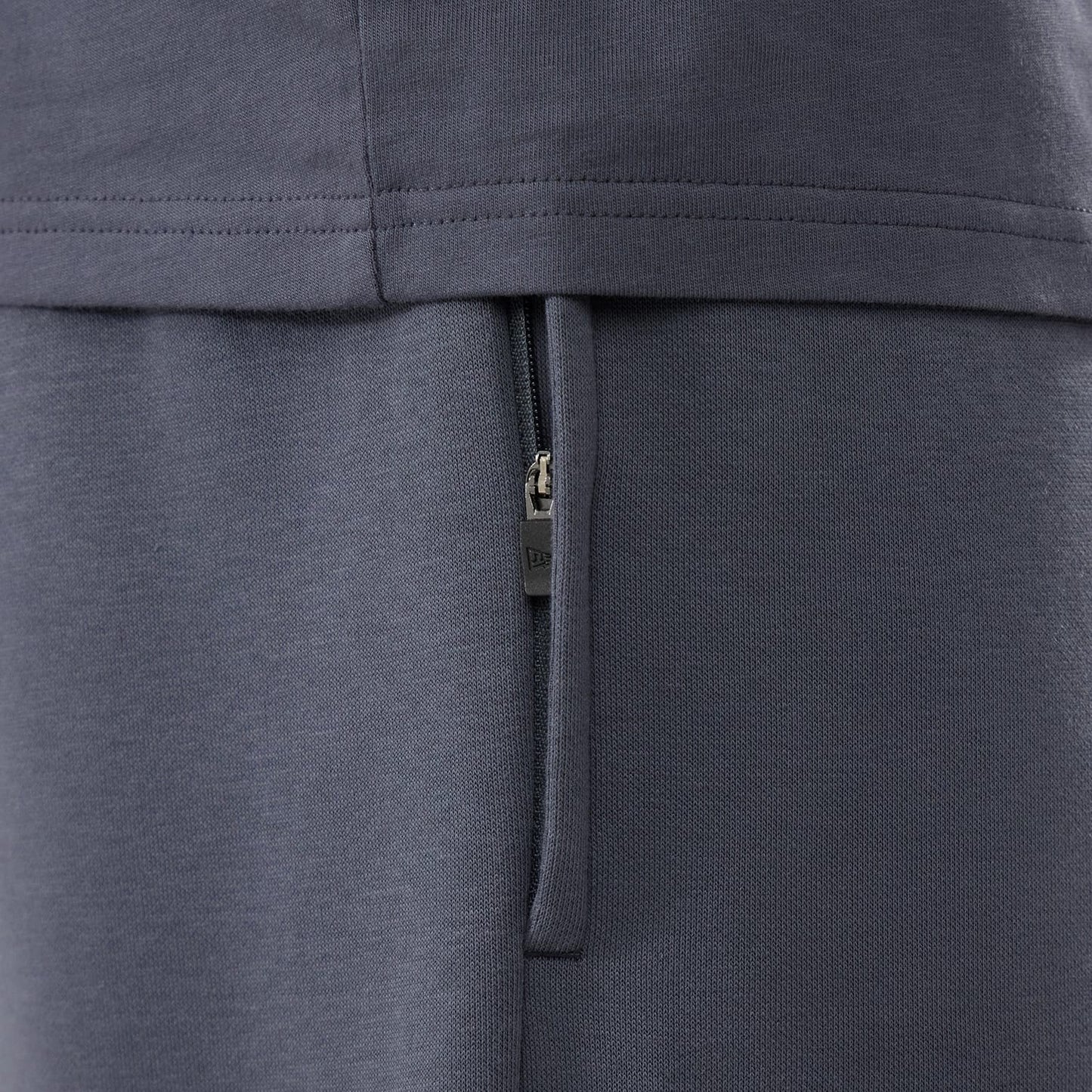 The model is wearing these New Era Tech Straight Leg Joggers in grey. 6