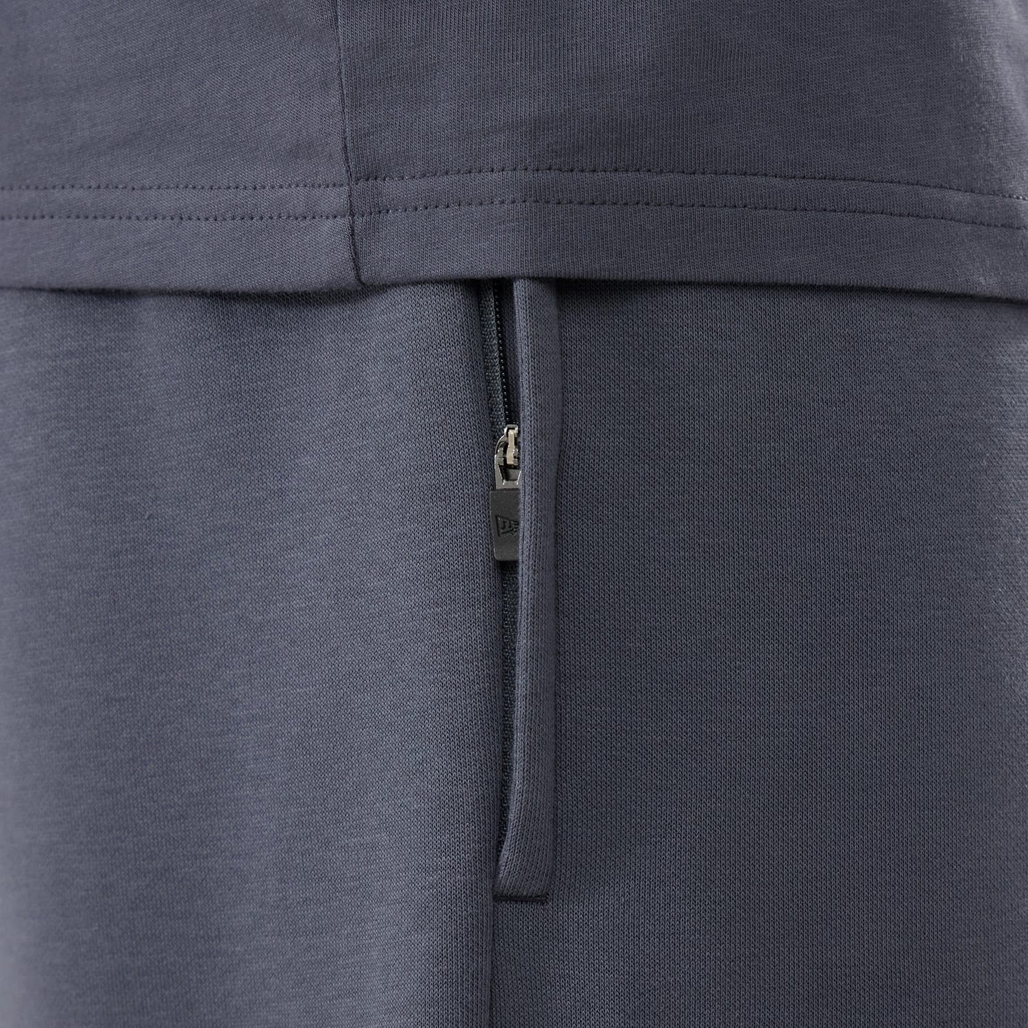 The model is wearing these New Era Tech Straight Leg Joggers in grey. 6