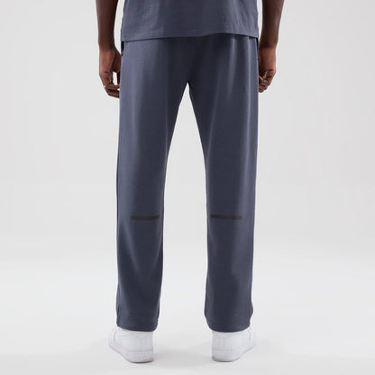 The model is wearing these New Era Tech Straight Leg Joggers in grey. 2