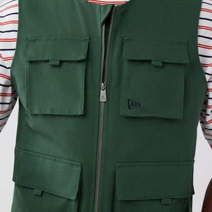 The model is wearing this New Era Utility Vest in dark green. 5