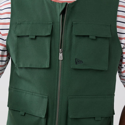 The model is wearing this New Era Utility Vest in dark green. 5