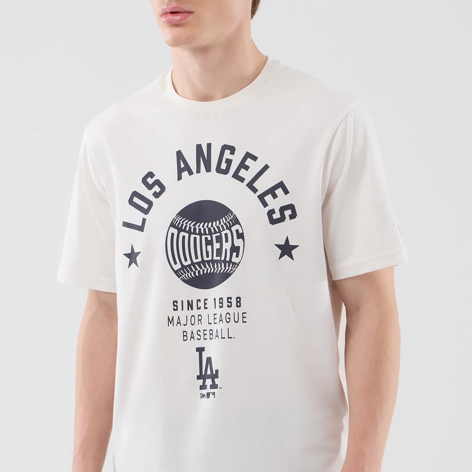The model is wearing this MLB Graphic LA Dodgers T-Shirt in open white. 3