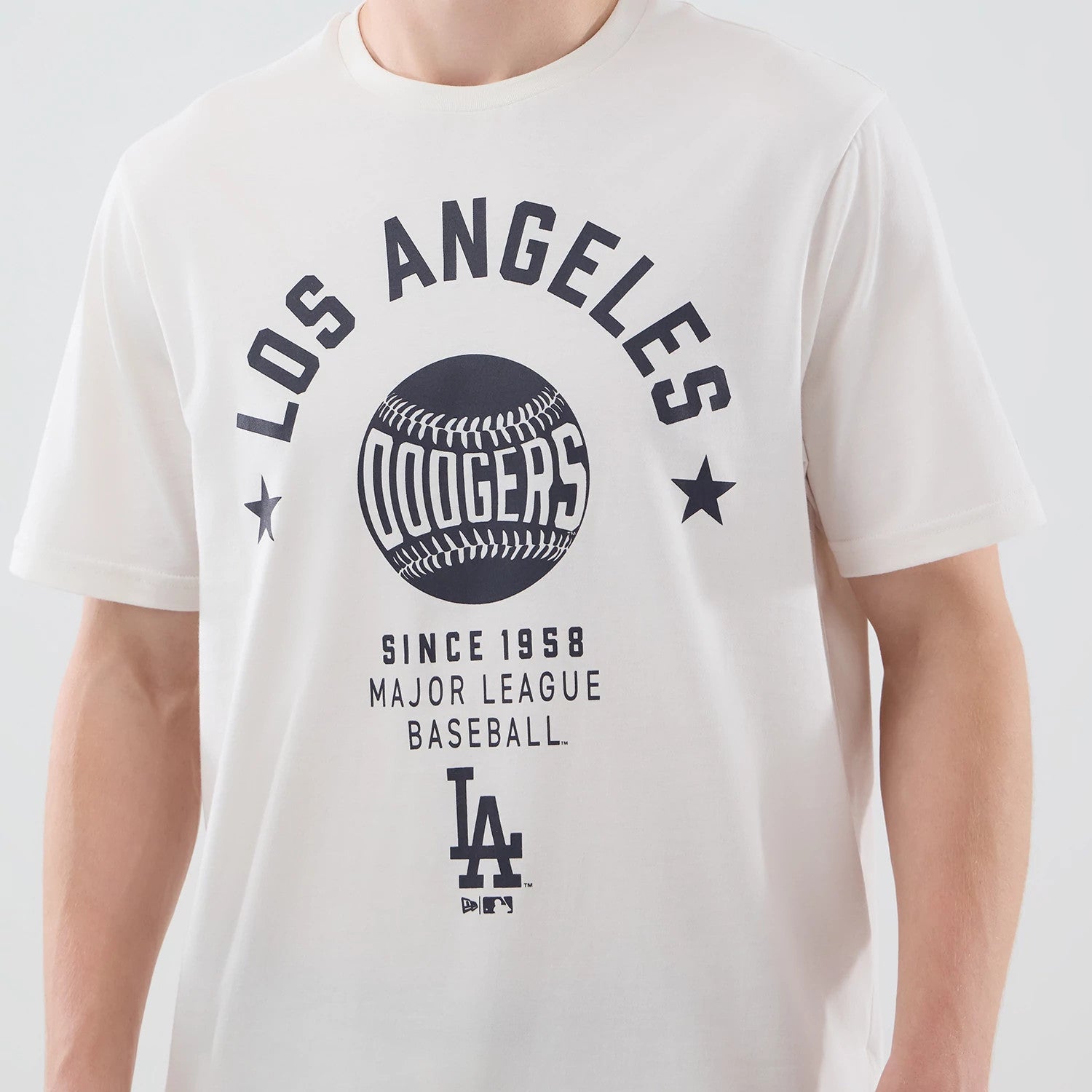 The model is wearing this MLB Graphic LA Dodgers T-Shirt in open white. 4