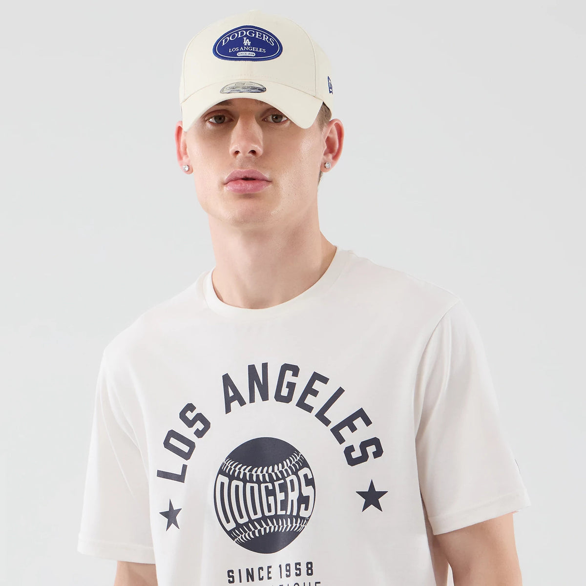 The model is wearing this MLB Graphic LA Dodgers T-Shirt in open white. 6