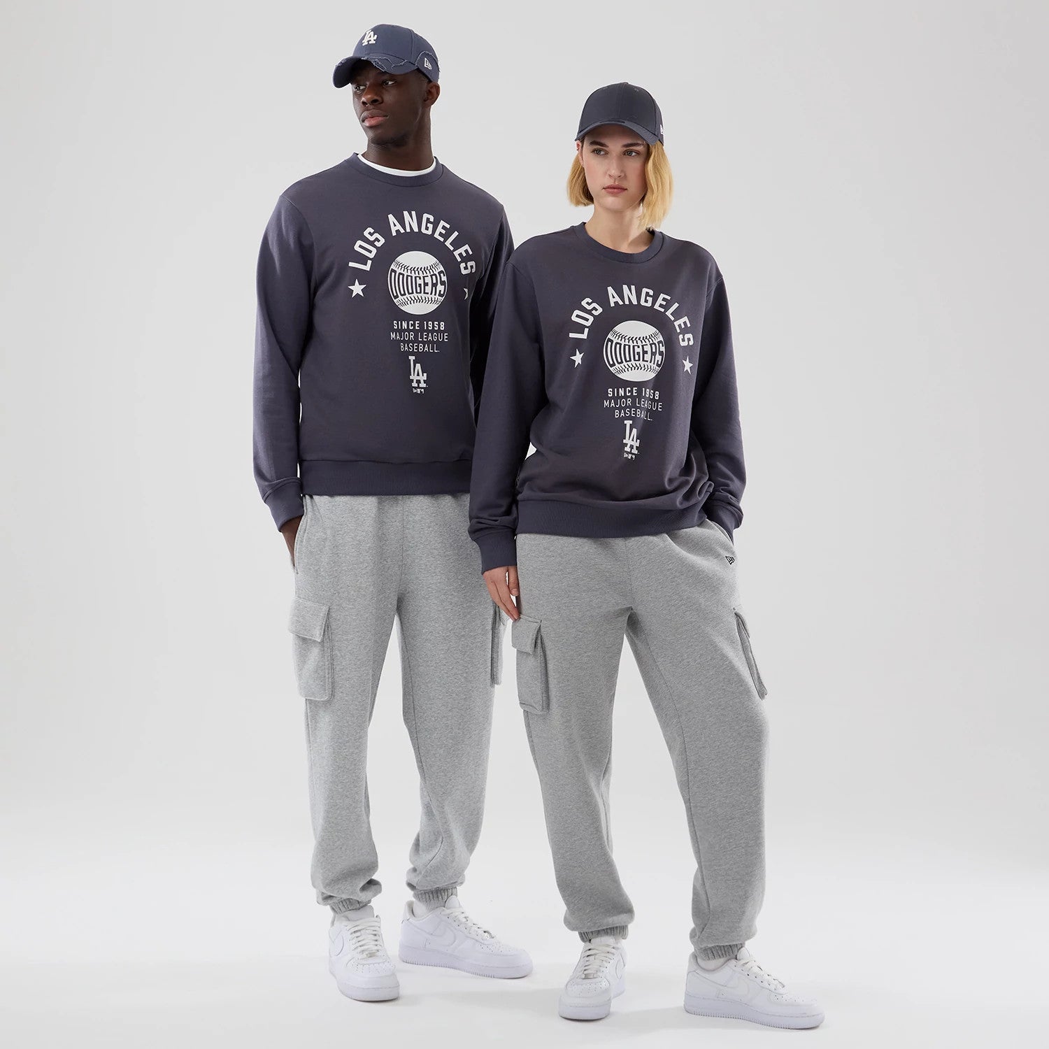 The model is wearing this MLB Graphic LA Dodgers Oversized Crew Neck Sweater in grey. 1