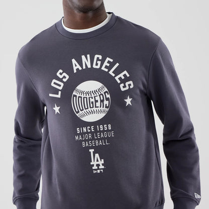 The model is wearing this MLB Graphic LA Dodgers Oversized Crew Neck Sweater in grey. 5