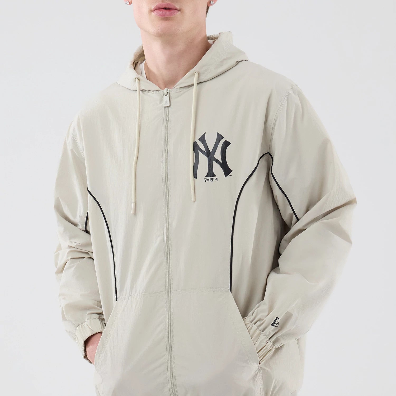The model is wearing this MLB Piping New York Yankees Jacket in cream. 3