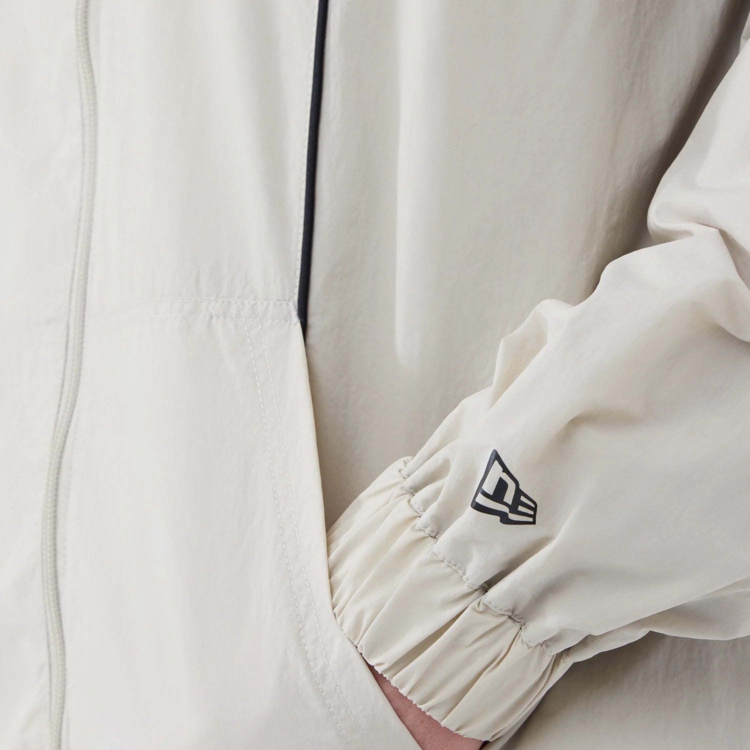 The model is wearing this MLB Piping New York Yankees Jacket in cream. 5