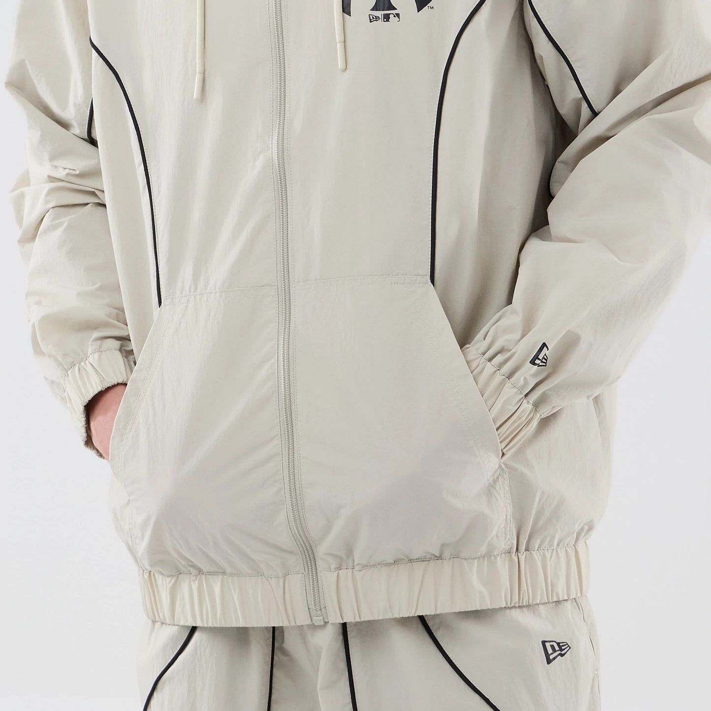 The model is wearing this MLB Piping New York Yankees Jacket in cream. 6
