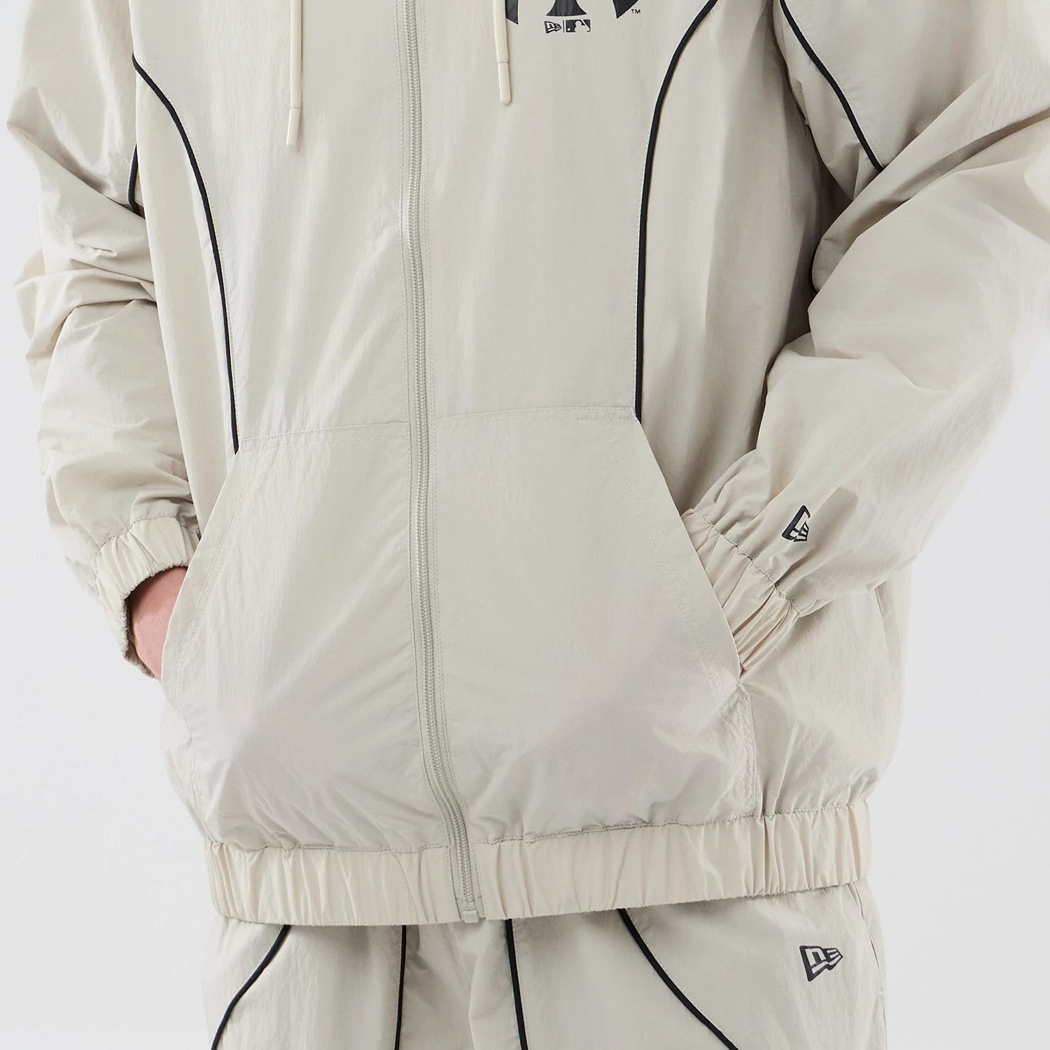 The model is wearing this MLB Piping New York Yankees Jacket in cream. 6