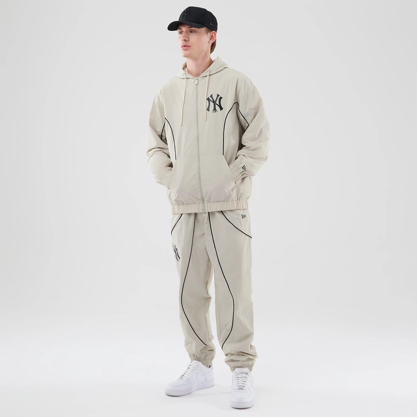 The model is wearing this MLB Piping New York Yankees Jacket in cream. 8