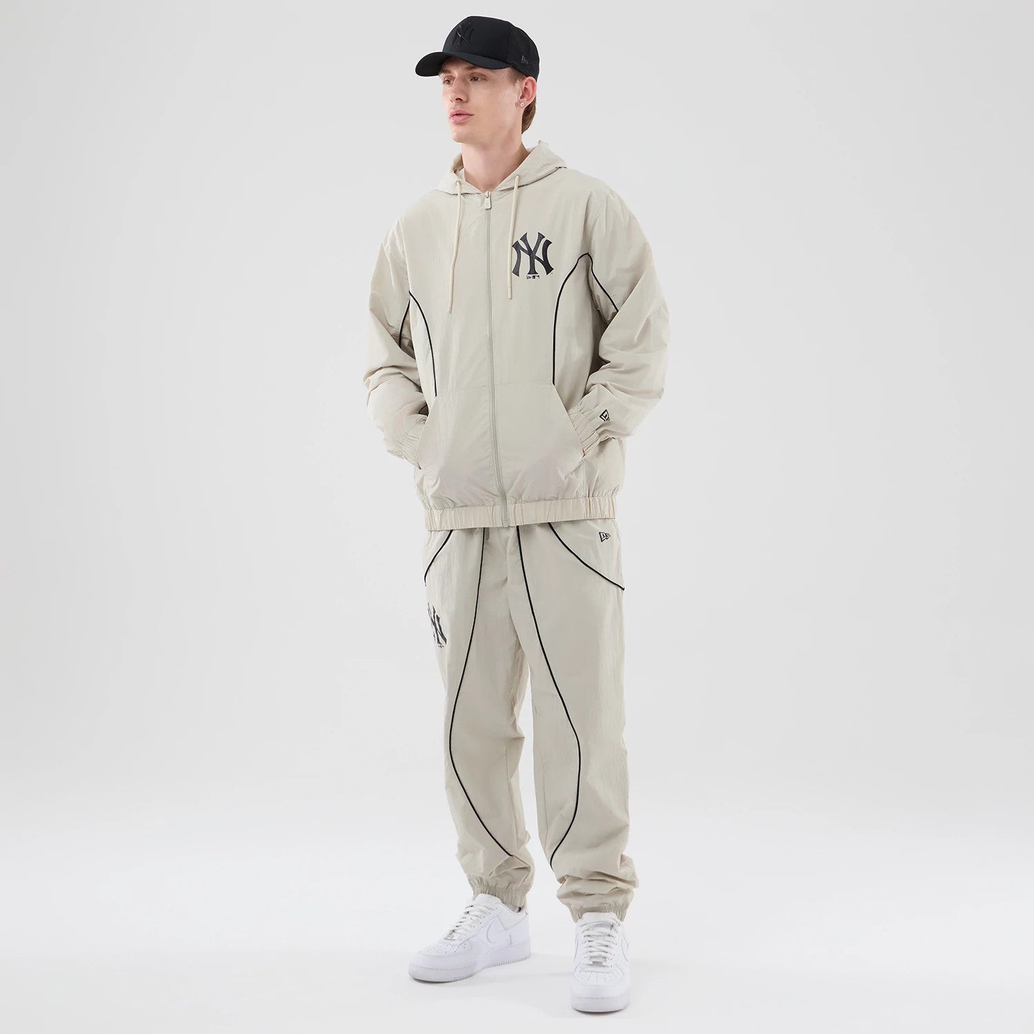The model is wearing this MLB Piping New York Yankees Jacket in cream. 8