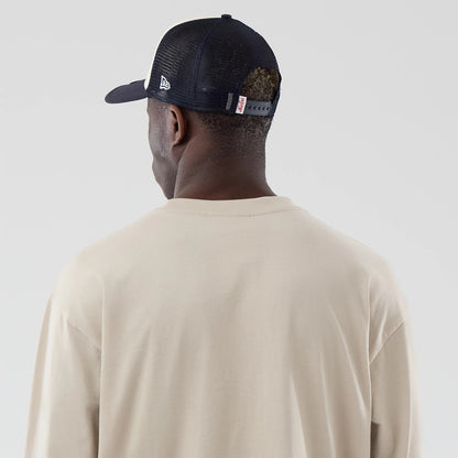 The model is wearing this MLB New York Yankees Oversized Long Sleeve T-Shirt in light beige. 6