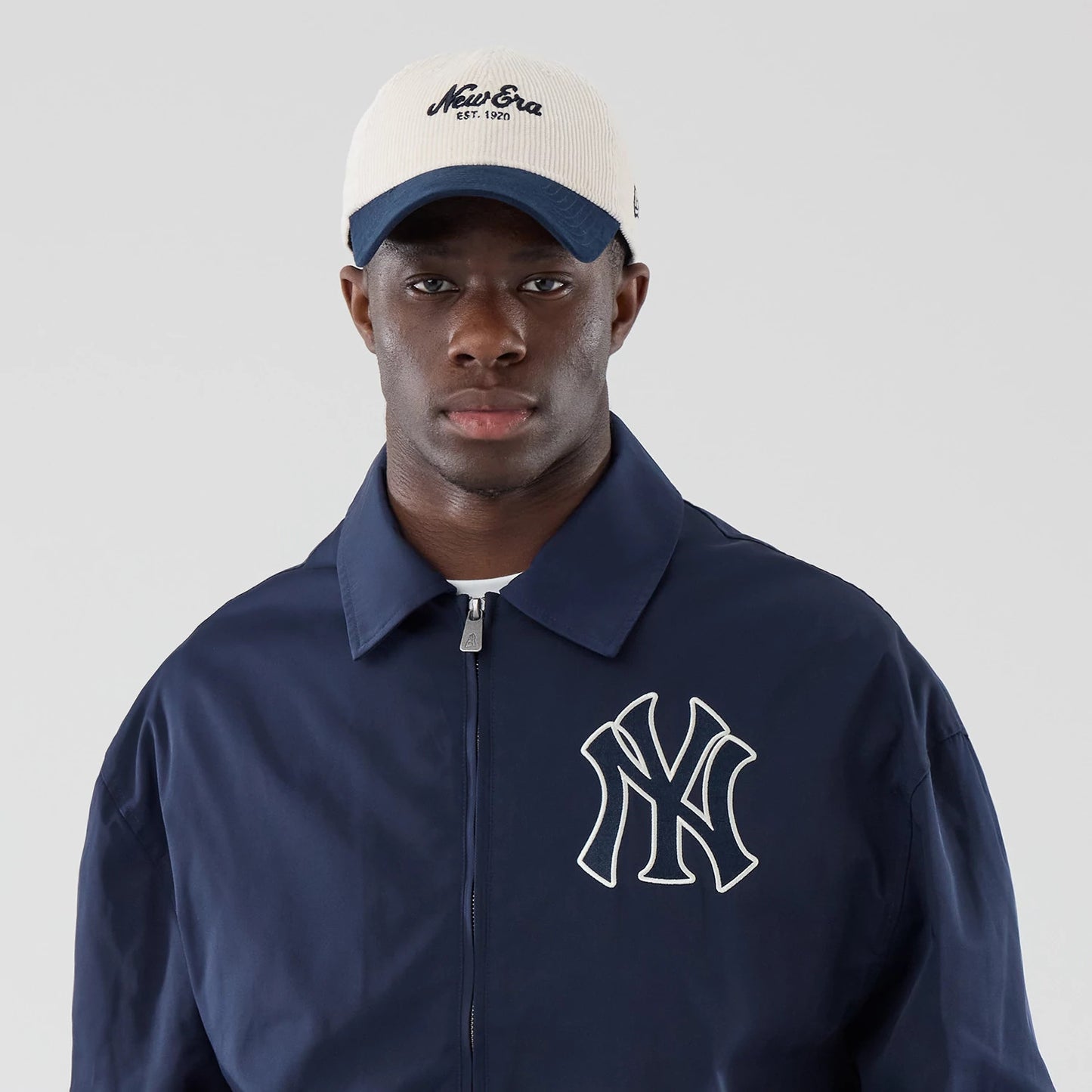 The model is wearing this MLB Collared New York Yankees Jacket in navy. 6
