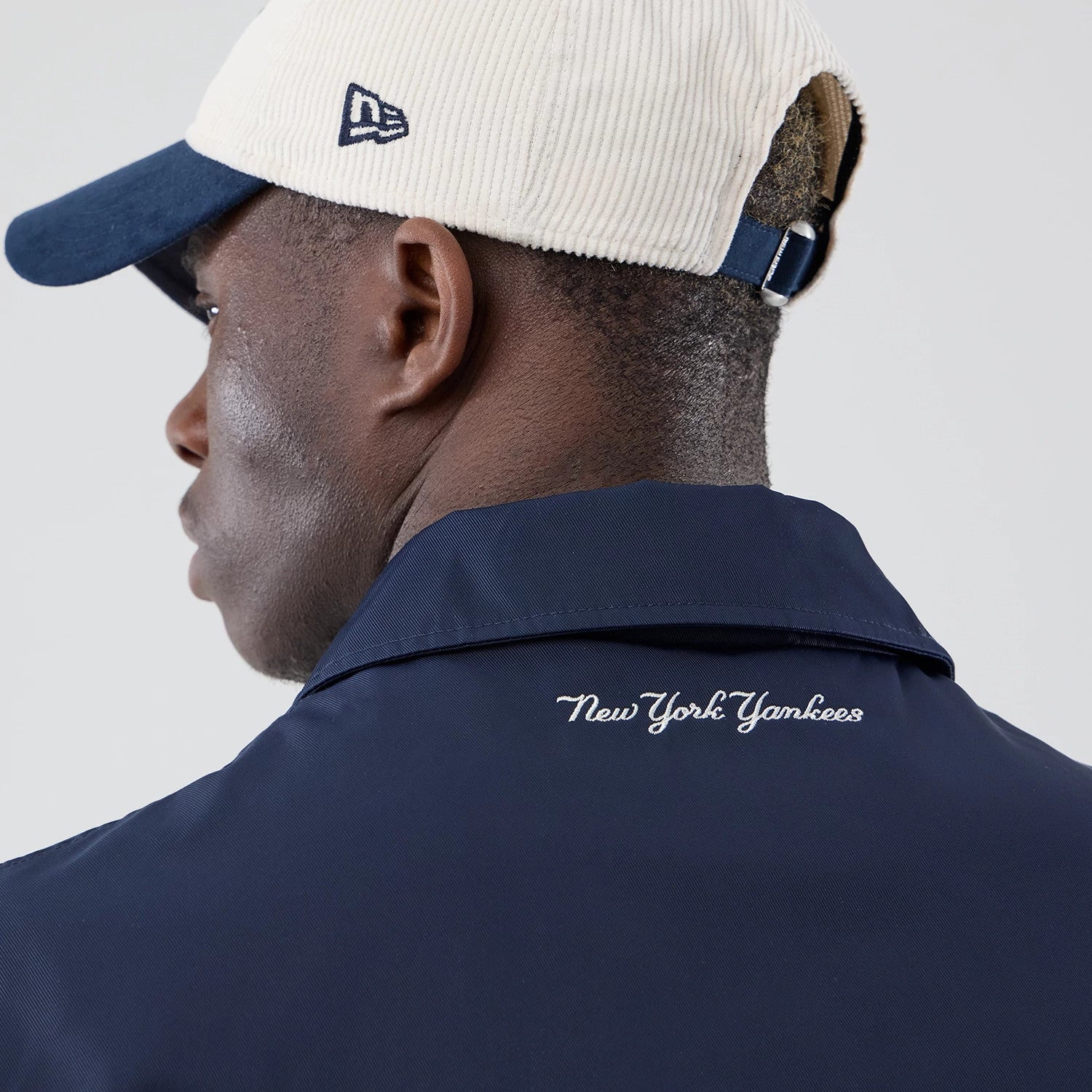 The model is wearing this MLB Collared New York Yankees Jacket in navy. 7