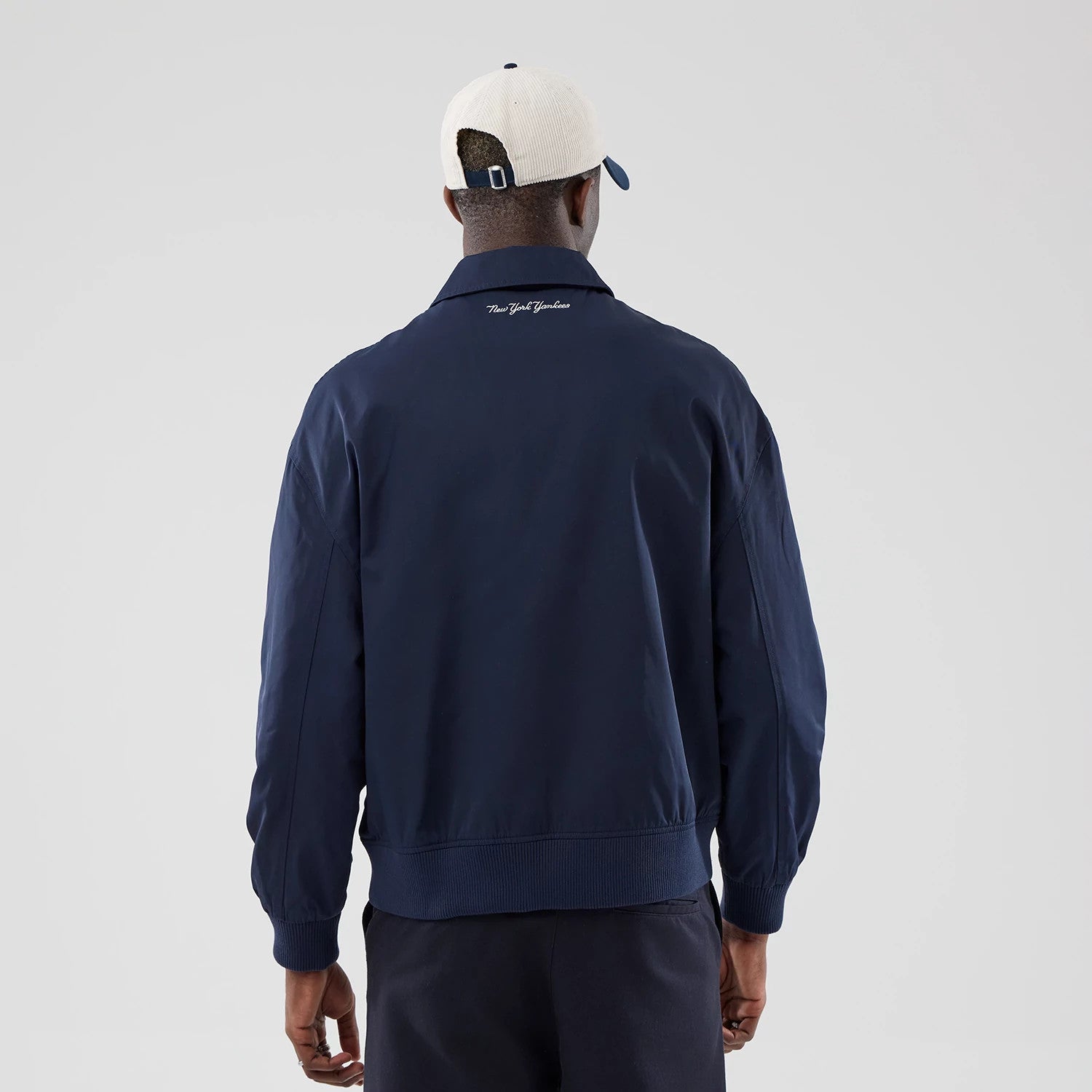 The model is wearing this MLB Collared New York Yankees Jacket in navy. 2