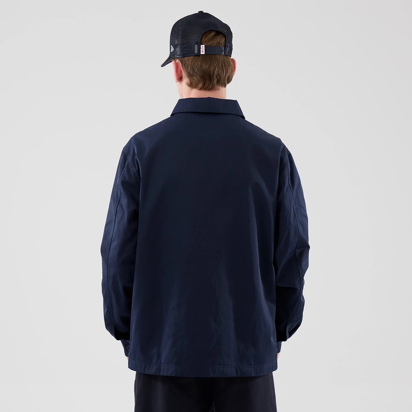 The model is wearing this New Era Shacket in navy. 2