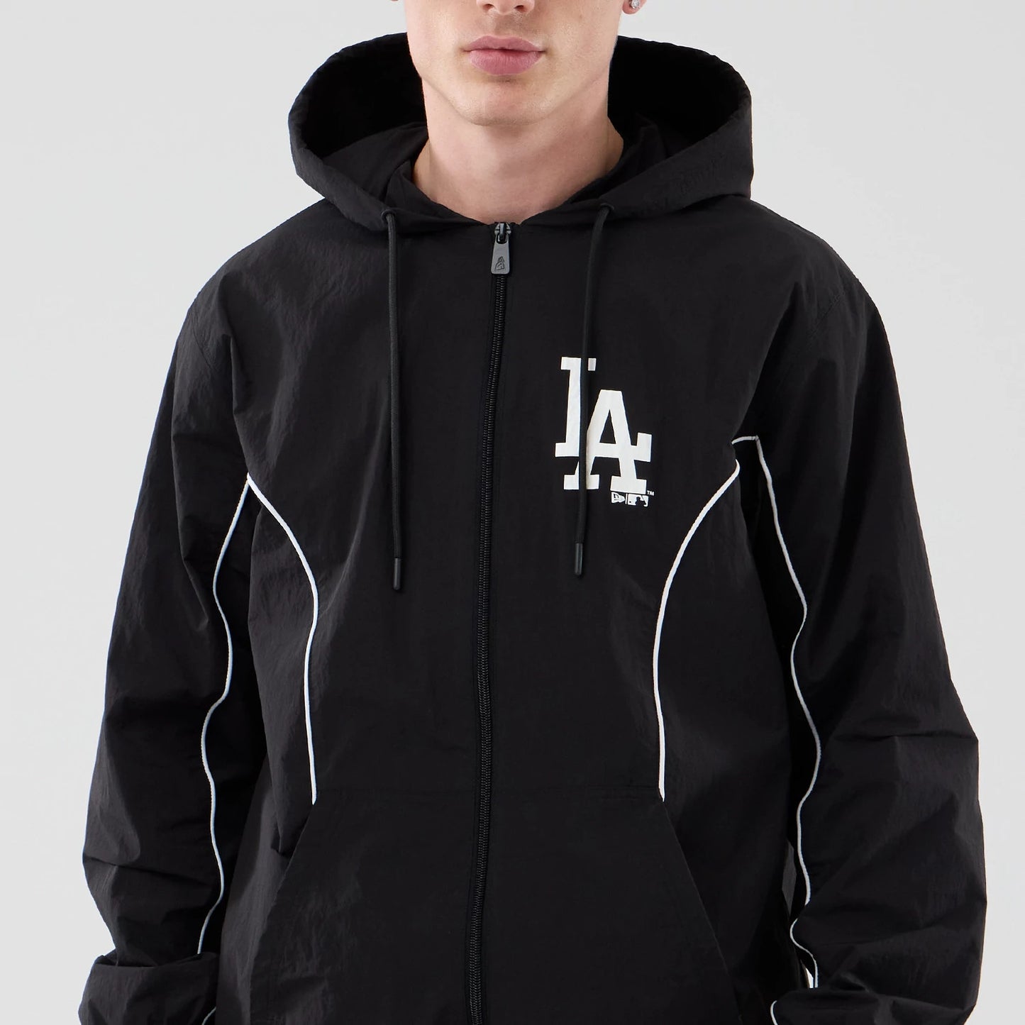 The model is wearing this MLB Piping LA Dodgers Jacket in black. 3