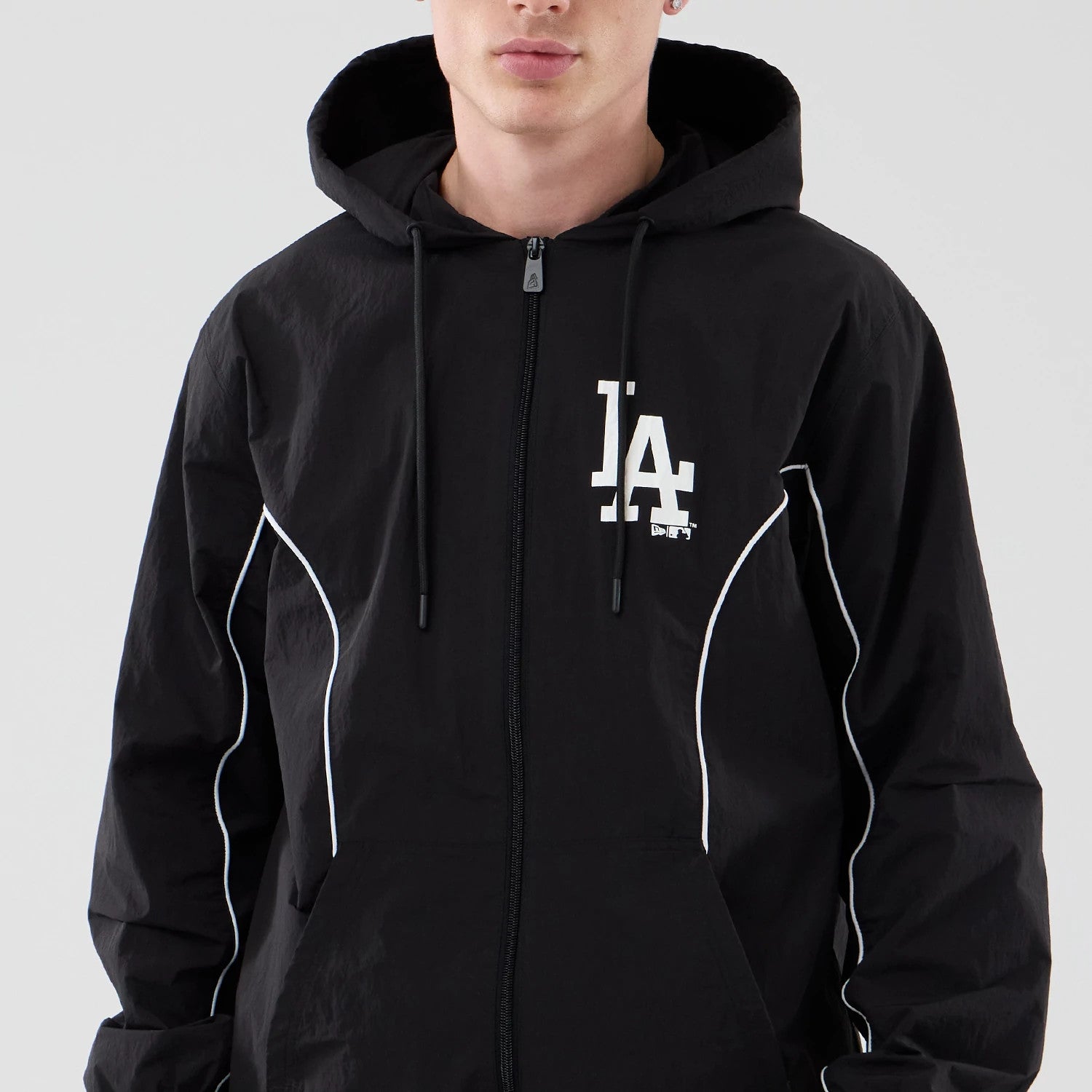 The model is wearing this MLB Piping LA Dodgers Jacket in black. 3