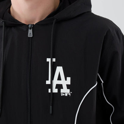 The model is wearing this MLB Piping LA Dodgers Jacket in black. 4