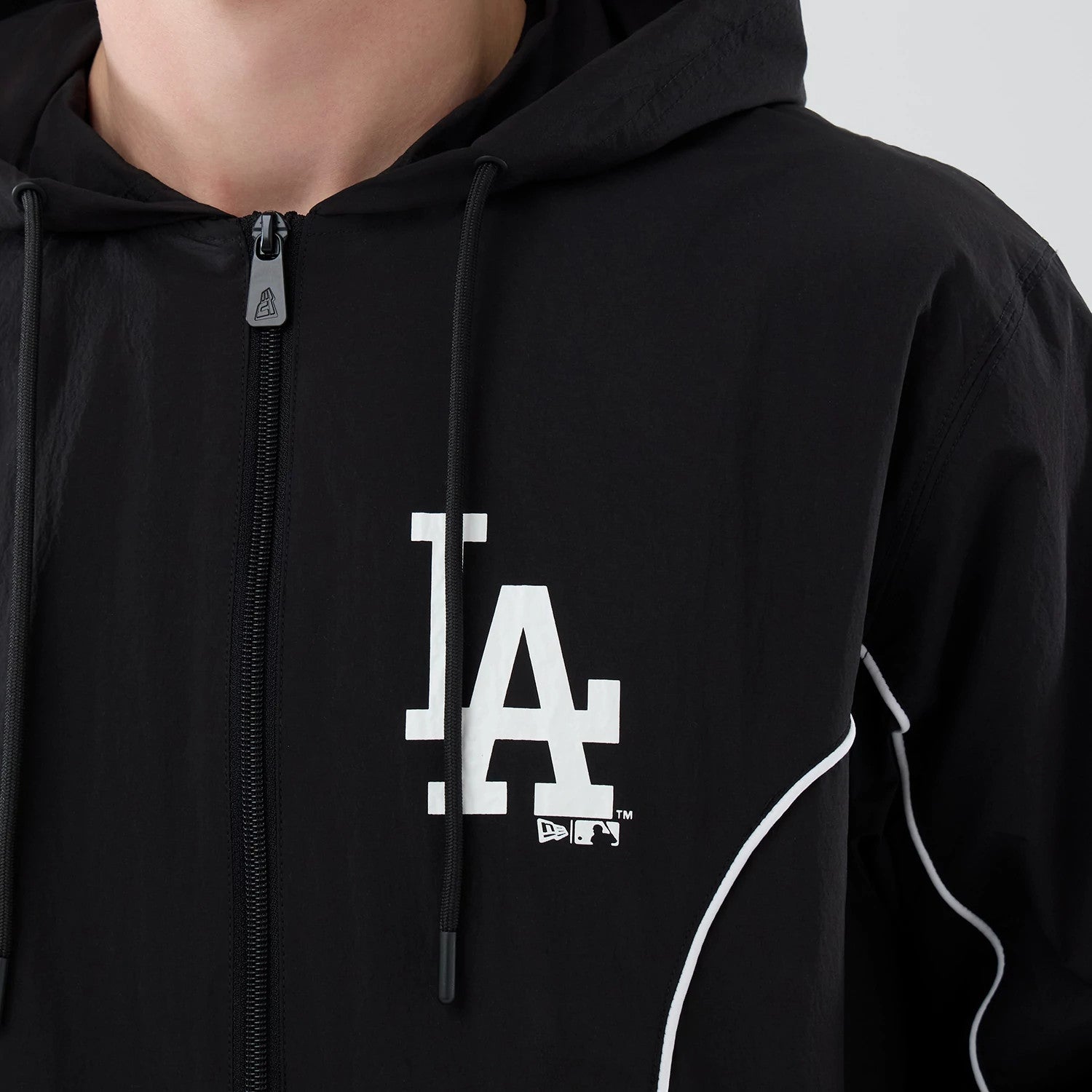 The model is wearing this MLB Piping LA Dodgers Jacket in black. 4