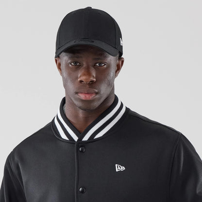 The model is wearing this New Era Jersey Bomber Jacket in black. 7