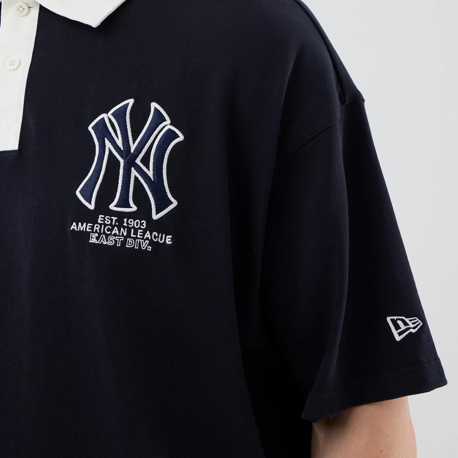The model is wearing this MLB New York Yankees Polo T-Shirt in navy. 5