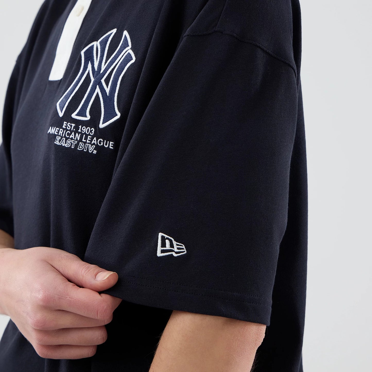 The model is wearing this MLB New York Yankees Polo T-Shirt in navy. 7