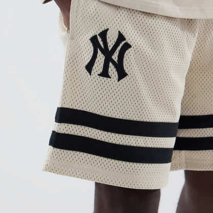 The model is wearing these MLB New York Yankees Oversized Mesh Shorts in light beige. 3