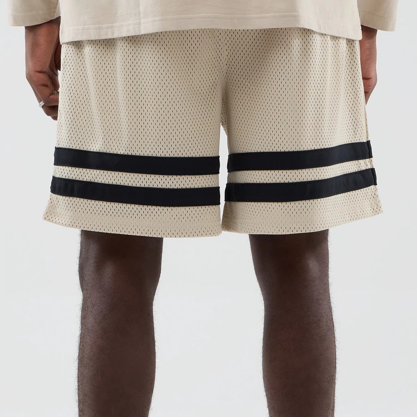 The model is wearing these MLB New York Yankees Oversized Mesh Shorts in light beige. 6