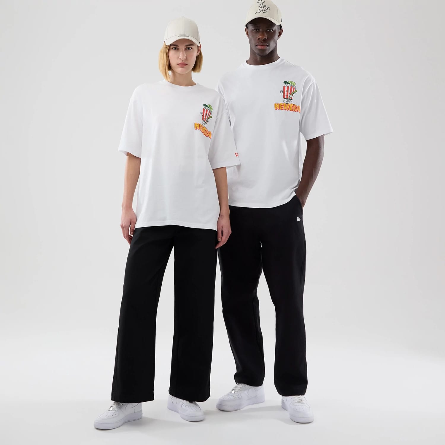 The model is wearing this New Era Food Graphic Oversized T-Shirt in white. 1