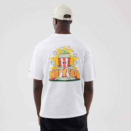 The model is wearing this New Era Food Graphic Oversized T-Shirt in white. 2