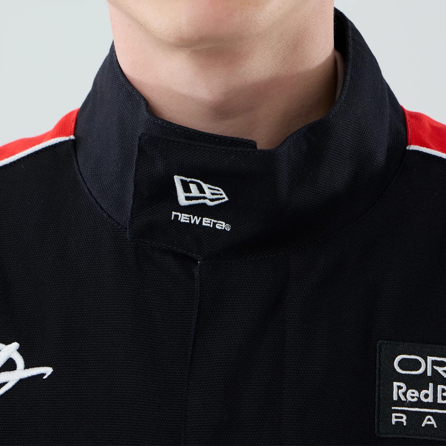 The model is wearing this Red Bull Racing Motorsport Jacket in black. 4