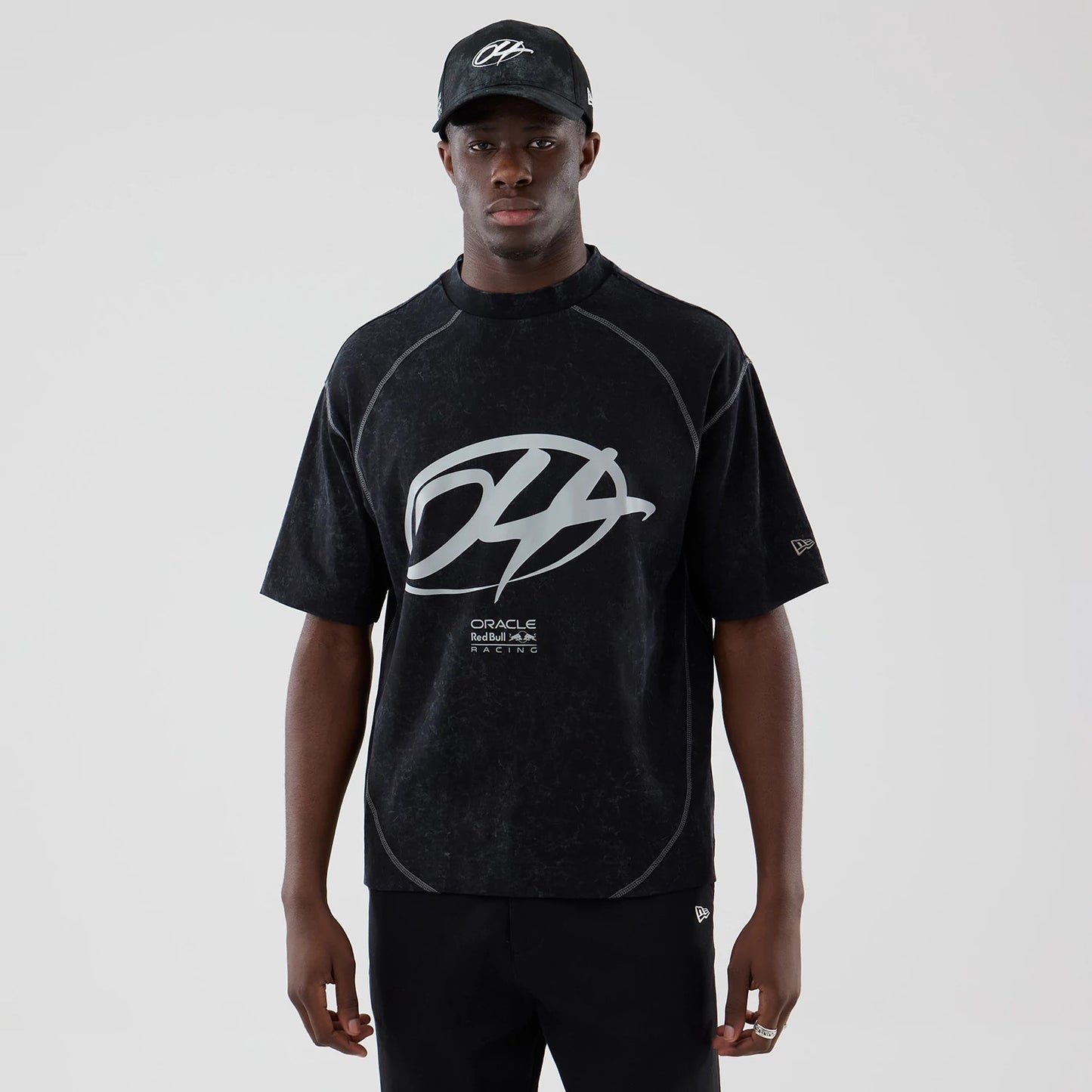 The model is wearing this Red Bull Racing Drop Shoulder T-Shirt in black. 1